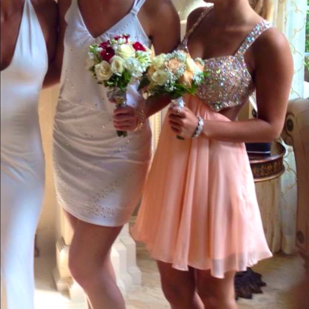 La femme peach bedazzled prom dress